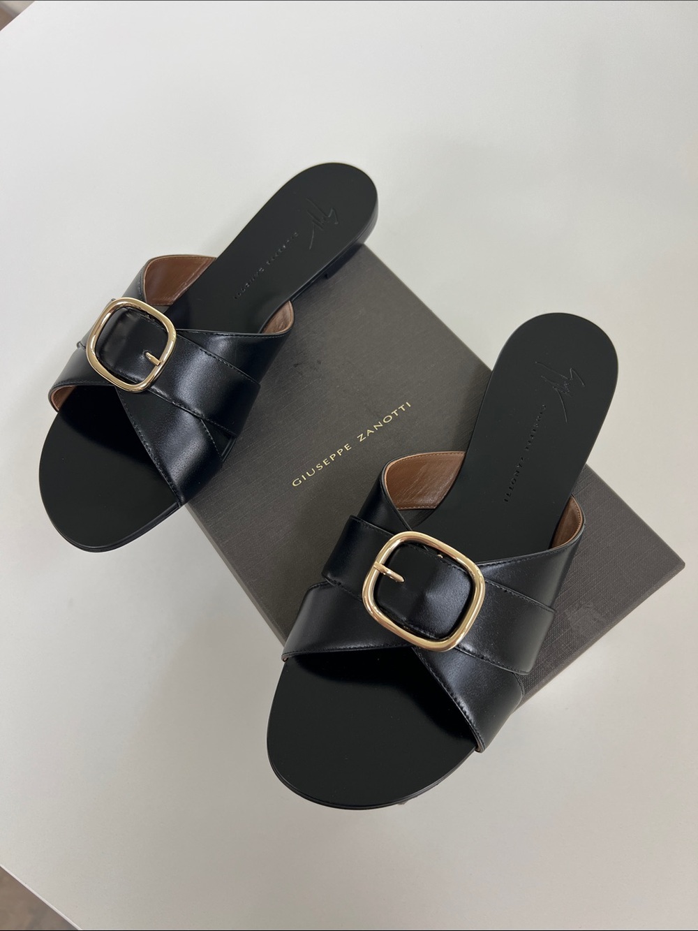 Giuseppe Zanotti roll muse open toe black leather flat sandals gold tone buckles